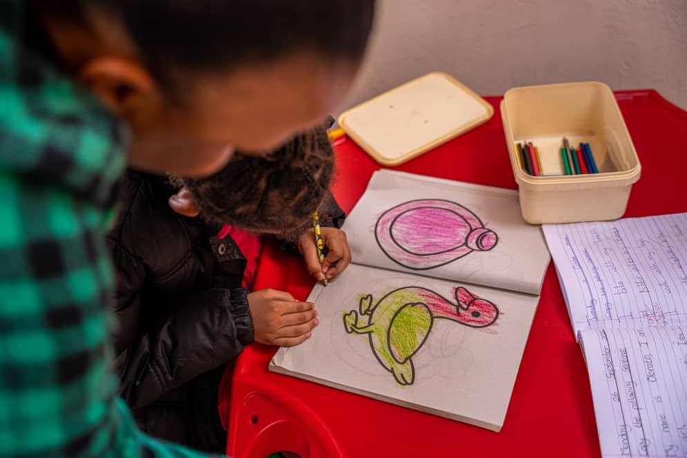 A learner drawing in class